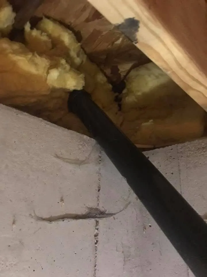 Black pipe rim joist fiberglass insulation gap