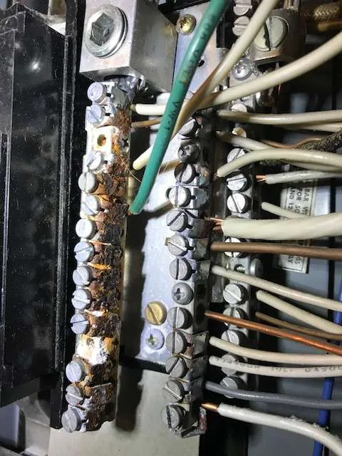 Corroded rusty neutral bus bar electrical panel