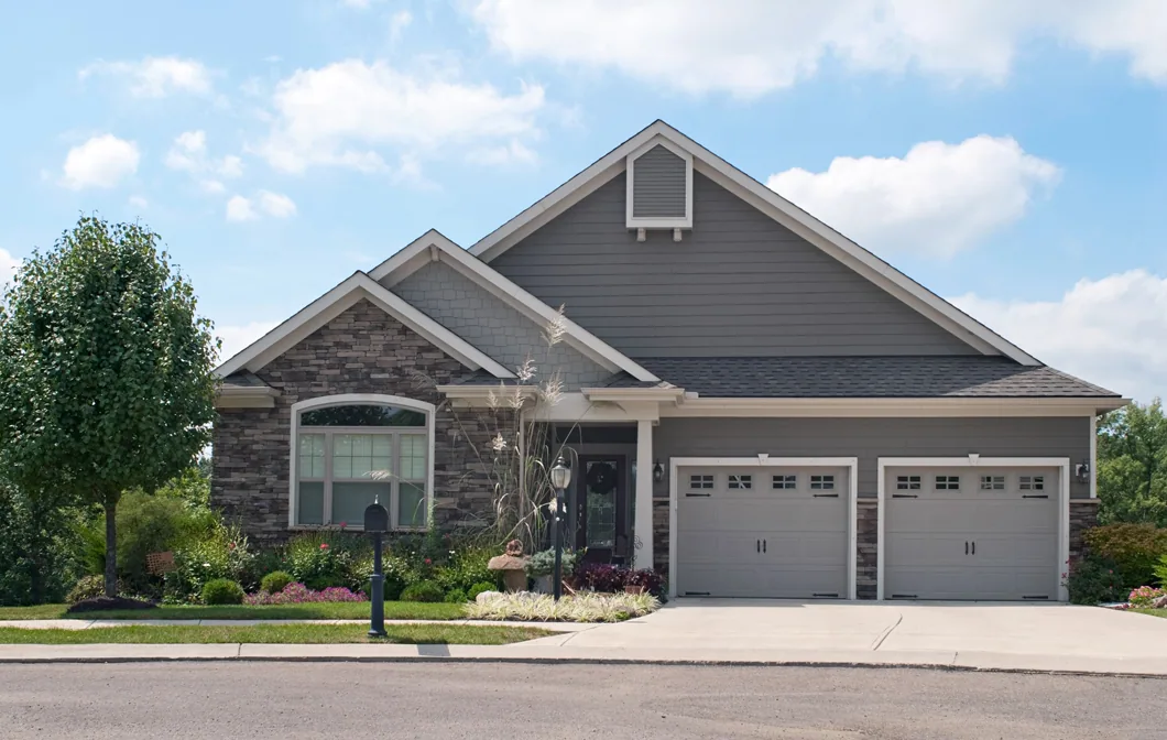 Gray ranch house two car garage