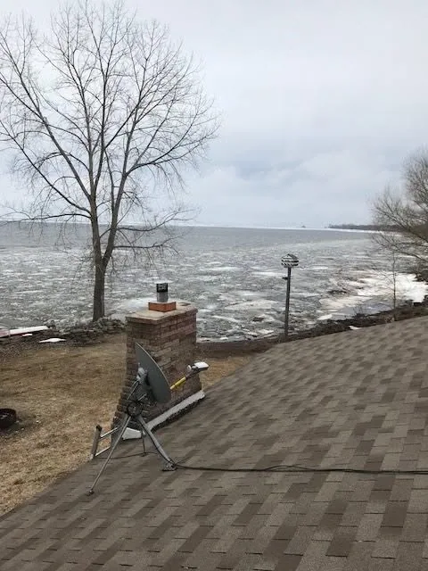 Lakefront roof chimney satellite dish ice shoreline