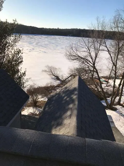 Rooftop view gable shingles frozen lake