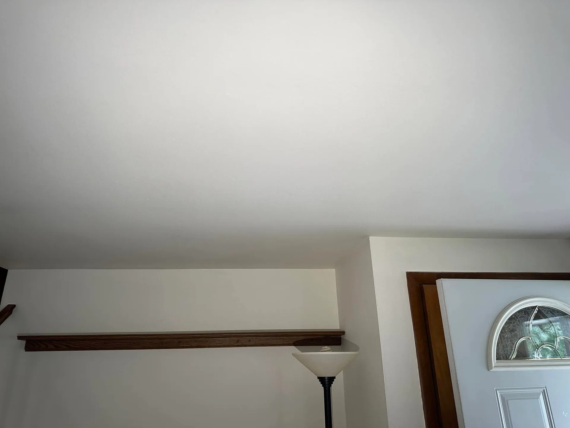 Smooth white ceiling oak trim ledge torchiere lamp entry door fanlight