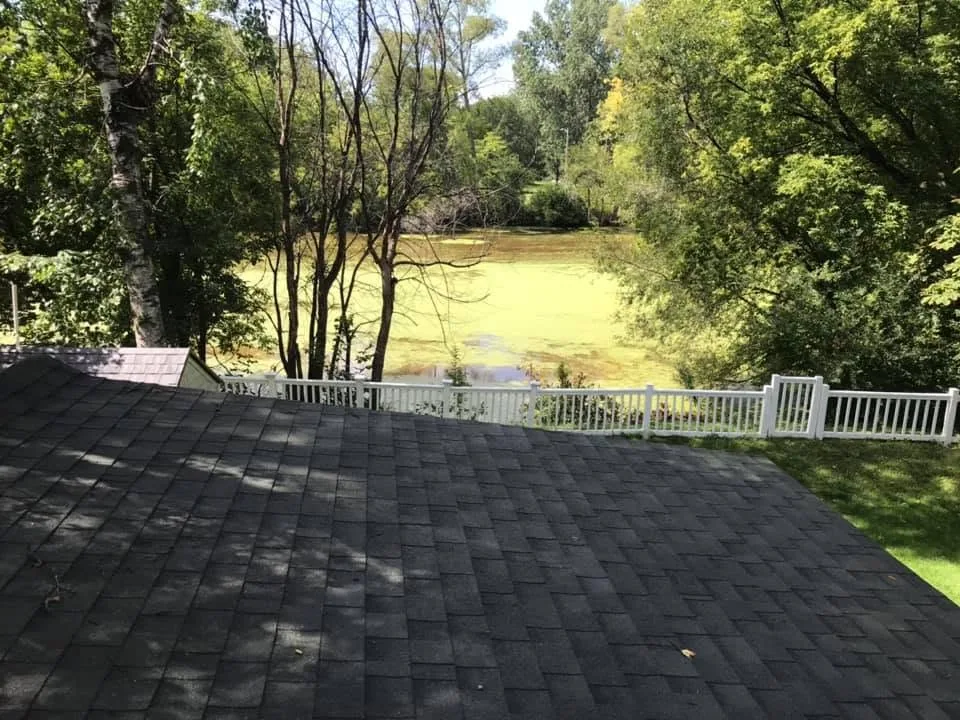 Summer roof view algae pond white vinyl fence