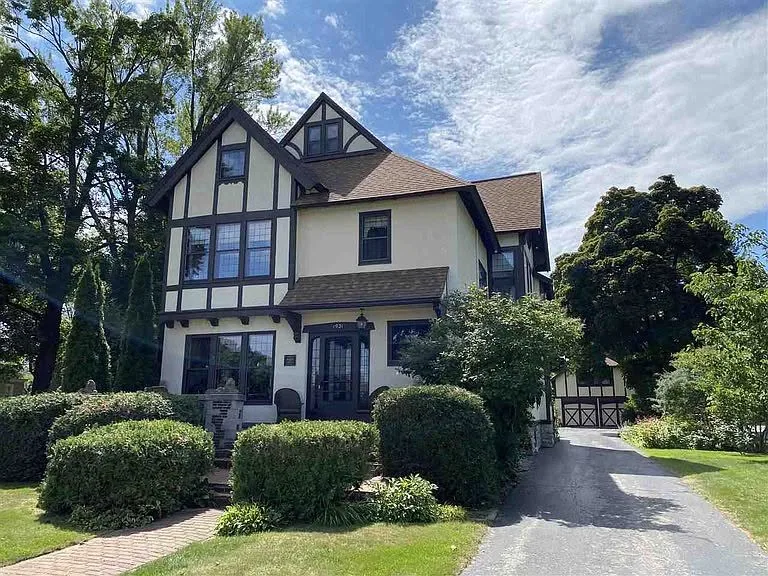 Tudor revival house exterior half timber stucco driveway