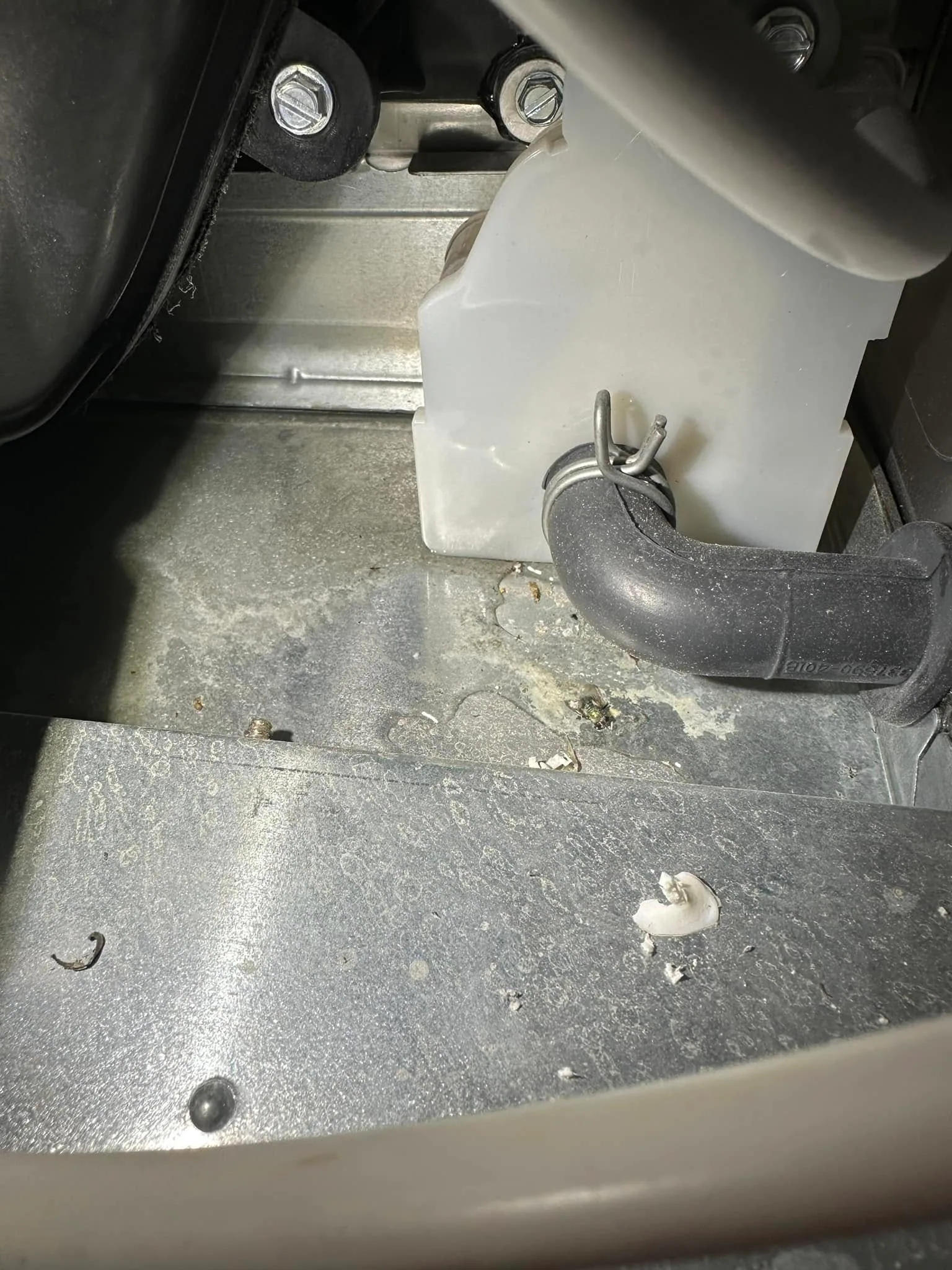 White condensate trap rubber elbow wet furnace floor